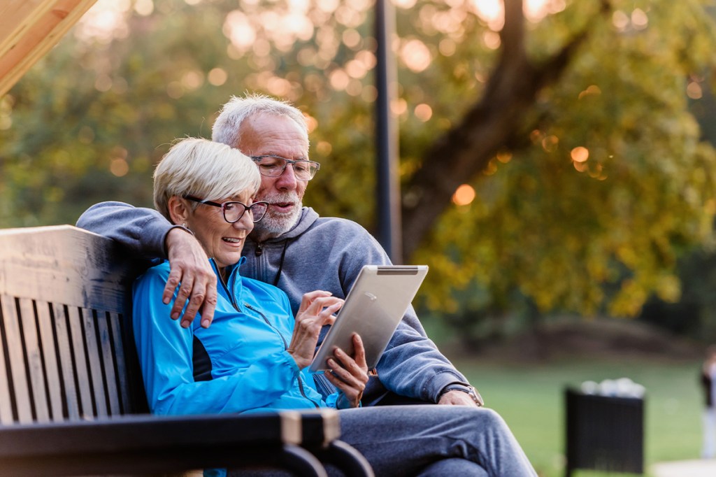 Older couple looking at the Yardi Breeze Spring 2024 Update on a tablet